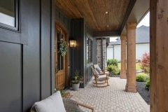 cincinnati custom home covered front porch dark exterior with cedar pillars