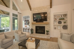 Great Room with cathedral ceiling beams and custom built-ins
