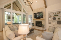 Great Room with cathedral ceiling beams and first floor bar