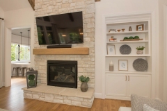 Custom home stone fireplace with custom buit-ins