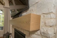 Cincinnati custom home stone fireplace with white oak matel
