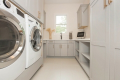 cincinnati custom home laundry with open and closed storage