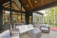 Custom home covered porch cathedral ceilings