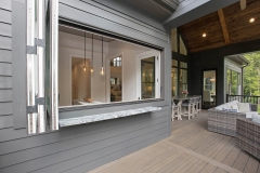 Custom home covered porch and pass through window