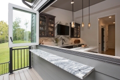 Custom home covered porch and pass through window