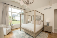 primary bedroom with cathedral ceiling and trusses in custom home in cincinnati