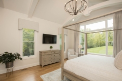 primary bedroom with cathedral ceiling and trusses in custom home in cincinnati