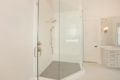 custom home primary suite with oversized walk-in shower