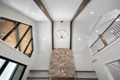 Open Cathedral Ceiling In Great Room With Beams and Loft