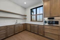 Hidden Pantry With Open and Closed Shelving