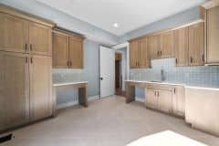 Wood Stained Cabinetry In Laundry With Pet Areas