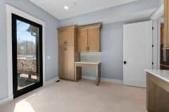 Wood Stained Cabinetry In Laundry with Pet Spaces