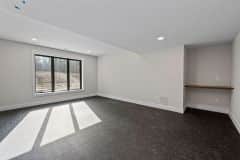 Lower  Level Exercise Room With Custom Wood Shelf