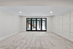 Lower Level Walk-out And Wainscotting Accent Wall