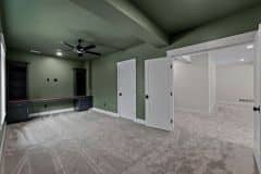 Lower Level Office With Acoustical Wood Panels and Butcher Clock Desk Countertop