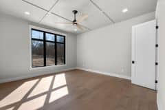 Primary Bedroom With Wainscotting