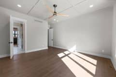 Primary Bedroom With Wainscotting Entry To Bathroom