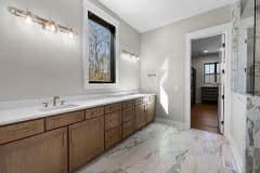 Double Vanity Wood Stained Cabinetry with Window