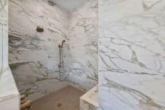 Oversized Tile on Walls and Herringbone Tile Shower Floor