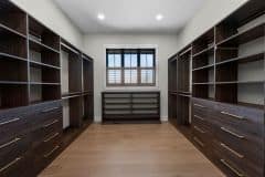 Dark Wood Stain Custom Walk-in California Closet with Window