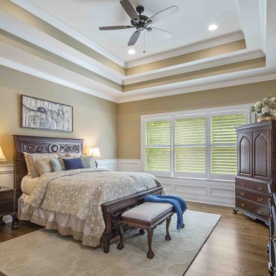 master bedroom with double tray ceiling