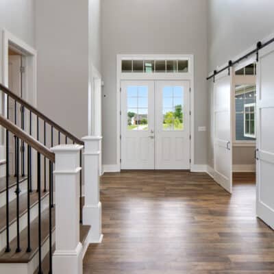 Two Story traditional custom home Dayton Ohio entry hall staircase barndoor