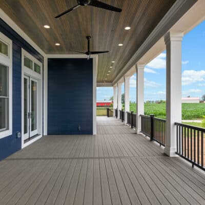 Two Story traditional custom home Dayton Ohio blue siding and white trim covered porch