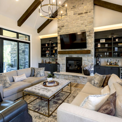 Great Room with Stone Fireplace, Built-ins and Outdoor Living Access