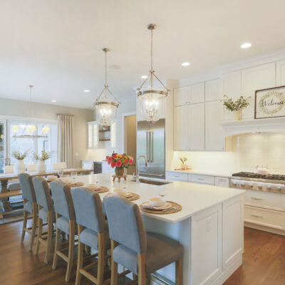 Kitchen with White Custom Cabinetry and Large Island with Seating