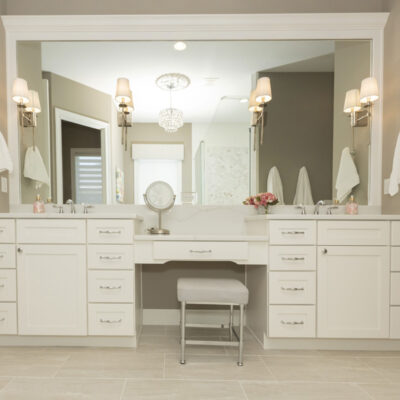 Primary Bathroom Vanity with Custom Cabinetry and Framed Mirror