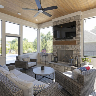 Covered Screen Porch with Stone Fireplace