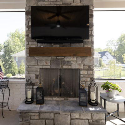 Covered Screen Porch with Stone Fireplace