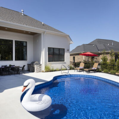 Rear Exterior of Home with Pool and Grilling Station