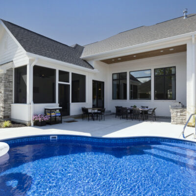 Rear Exterior of Home with Pool, Screened Porch and Grilling Station