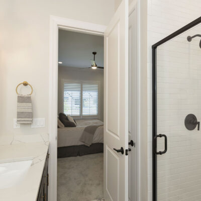 Bedroom 2 Bathroom with White Subway Tile and Black Framed Shower Door