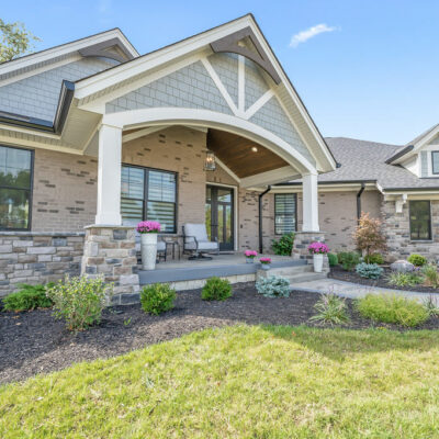 Modern Farmhouse Custom Home with Hardie Shake Siding, Brick and Large Covered Front Porch