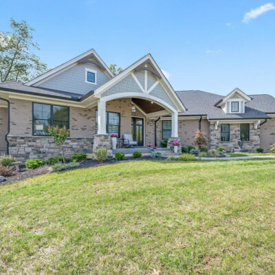 Modern Farmhouse Custom Home with Hardie Shake Siding, Brick and Canted 3 Car Garage