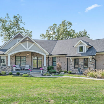 Modern Farmhouse Custom Home with Hardie Shake Siding, Brick and Canted 3 Car Garage