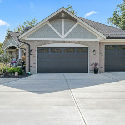 Modern Farmhouse Custom Home with Hardie Shake Siding, Brick and Canted 3 Car Garage