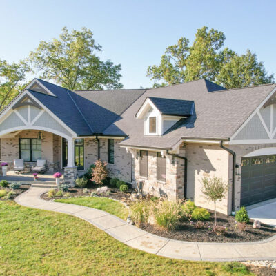 Modern Farmhouse Custom Home with Hardie Shake Siding, Brick and Canted 3 Car Garage