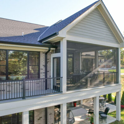 Back of Home with Large Porch with a Partial Screen-In Porch and Wrapped Hardie Pillars
