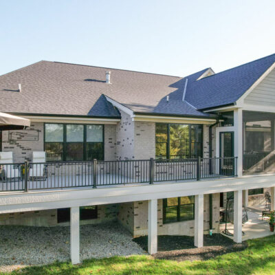 Back of Home with Large Porch with a Partial Screen-In Porch and Wrapped Hardie Pillars