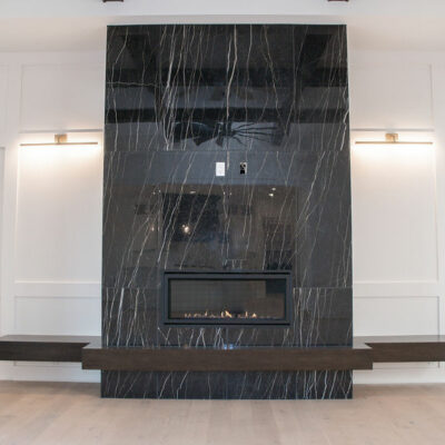 Marble Linear Fireplace with Wrap Around Bench and Hidden Door