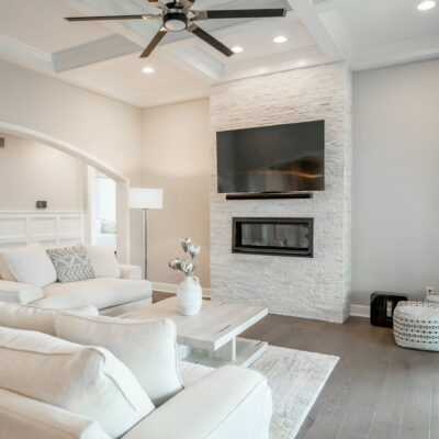 Modern Great Room with Coffered Ceiling and Linear Ledgestone Fireplace