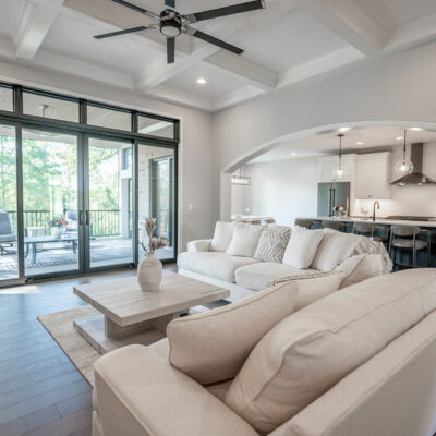 Modern Great Room with Coffered Ceiling and Walk-out to Screened-In Porch