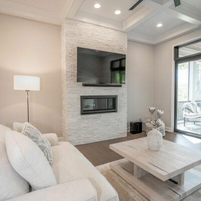 Modern Great Room with Coffered Ceiling and Linear Ledgestone Fireplace