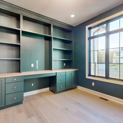 Study with custom green cabinetry
