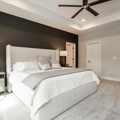 Primary Bedroom with Tray Ceiling and Walk-in Closet