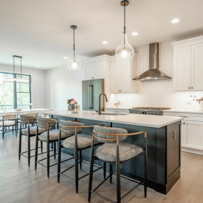 Modern Kitchen with Large Island and Dining Area with Walk-out to Screened Porch