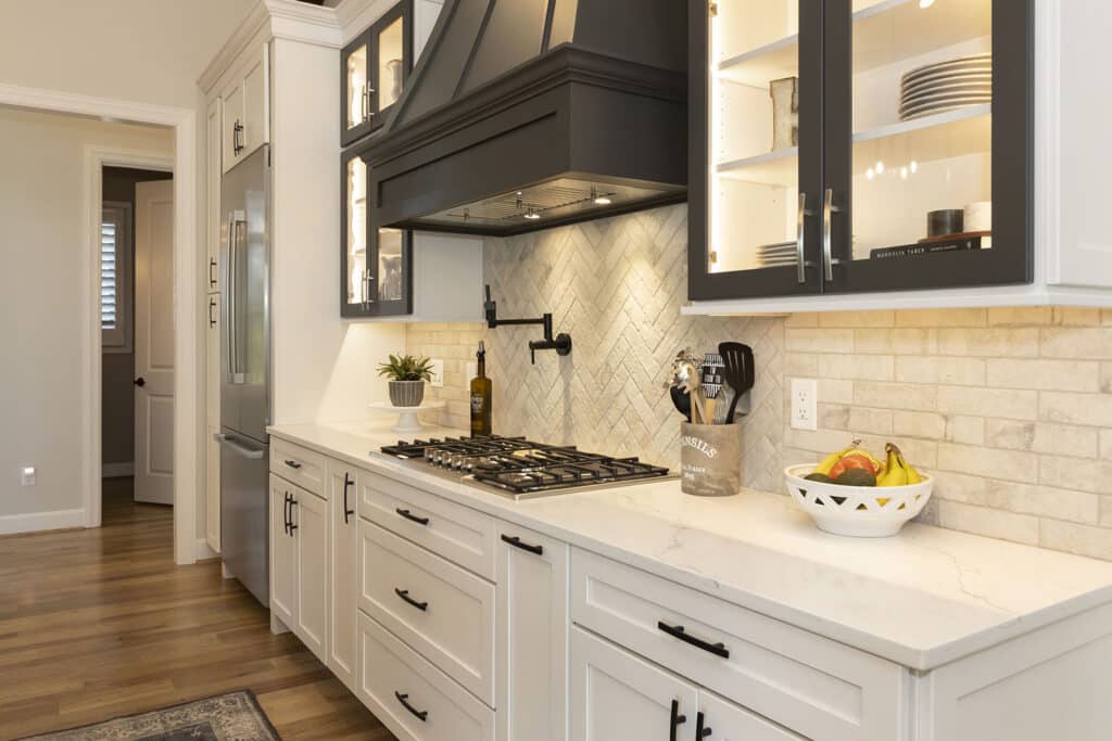 Brick Herringbone Tile Backsplash with Pot Filler